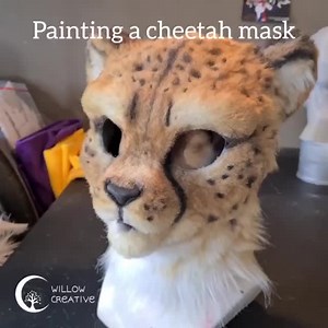I painted the cheetah mask! Now it finally looks like a cheetah and not just some white blob. This was painted with an Iwata Neo airbrush and Createx transparent airbrush paints. When you're painting faux fur or wig hair, always work from light (white) to dark, as you can add more dark but you cant add white or itll look crusty because white is always an opaque color! Transparent paints work best, such as transparent airbrush paints or inks. So not opaque acrylics or itll also quickly look crust