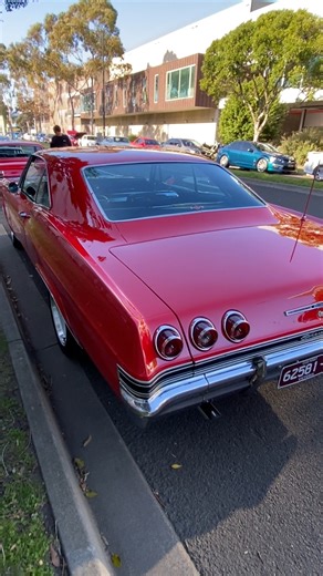 The 1965 Impala was a game-changer for Chevrolet, setting an unbeaten industry record with over a million units sold in the U.S. that year. The redesign brought a sleeker look with rounded sides, curved glass, and a semi-fastback roofline for Sport Coupes. Under the hood, Chevy offered a range of engines, from the inline-six to the new 396 Turbo Jet V8, which introduced the long-lasting Rochester Quadra-Jet carburetor. The SS (Super Sport) models were part of this lineup, likely contributing to 
