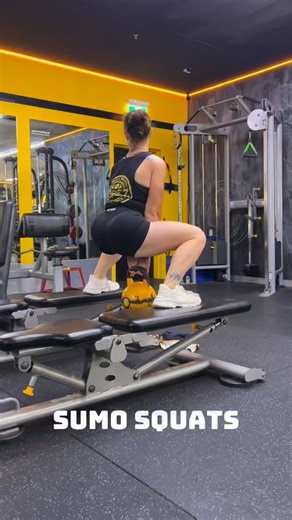 HOW TO: SUMO SQUAT 🔥 • Take a wide stance, toes turned slightly out • Brace your core and keep your chest tall • Push your hips back and down • Drive your knees out as you lower • Sit deep, keeping weight through your heels • Exhale and squeeze your glutes to stand tall Coaching cues: ✔️ Chest up ✔️ Knees out ✔️ Heels grounded ✔️ Control the tempo Great for glutes, inner thighs & overall lower-body strength 💪 Save this one & give it a crack next leg day 🤙 #VibeZFitness #SumoSquat #GluteWork #