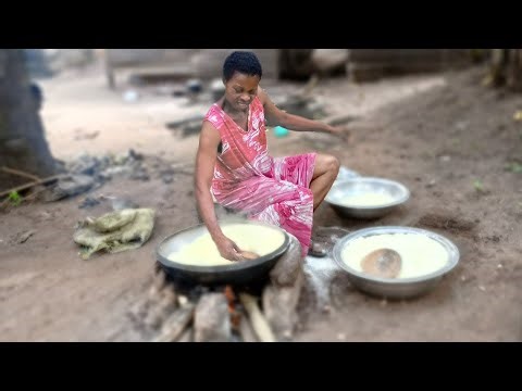 Frying Garri in an African village /Traditional method of doing it