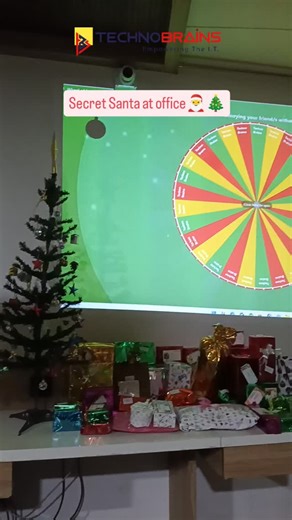 When HR turns Secret Santa into a full game show  . . . #SecretSanta #OfficeFun #CorporateLife #TeamVibes #OfficeCelebration . . . Secret Santa, office celebration, HR activities, team bonding, corporate fun, office culture, Christmas vibes, spin the wheel, fun questions, surprise gifts | TechnoBrains Business Solutions | Facebook