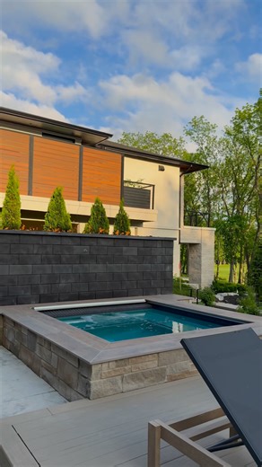 This is the backyard that everyone wants With a custom pool and spa, surrounded by built-in fire features and comfortable seating that bring the whole space together. From early morning swims to late-night gatherings by the fire, every detail of this layout was planned to make outdoor living easy. Landscape: P.J.E. Lawn Care & Landscaping Builder: Carrington Homes, Inc. Home Designer: Goldberg Design Group #backyarddesign #outdoorliving #outdoorlivingspace #landscaper #landscapingdesign #backyar