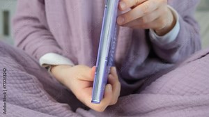 Woman closing a book, slow motion, hands close-up