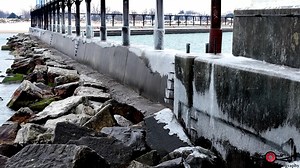 Ice season is here! The lighthouse, breakwall, and marina are already starting to freeze over. | Timeless Aerial Photography