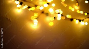 cozy light show with yellow string lights fading light show, cozy, yellow string lights, fade in, fade out, calming ambiance, gentle animation, new year, gatherings, background, festive, warm