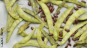Top view green bean pods and beans. Close up food background, texture, blurry image at the beginning is focused at the end