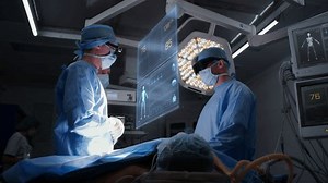 Doctors perform surgery in hospital operating room wearing AR headsets. 3D graphics of virtual AI holographic display showing vital signs and patient condition. VFX animation. Modern medicine concept.