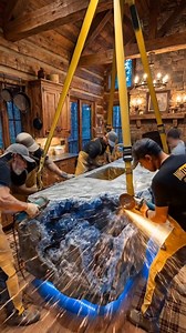 Step inside this majestic cabin kitchen featuring a massive stone island and luxurious design details. #LuxuryCabin #interiordesign #CabinVibes #MajesticDesign | Tiny Living Designs
