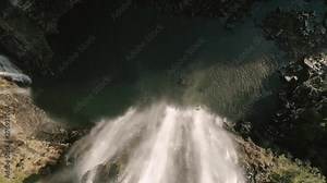 Waterfall Cascading Over Cliff Edge Rising Top Down Drone Shot