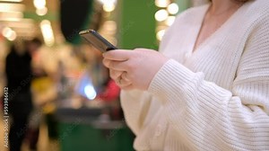 Finger of woman touching scroll page app on mobile phone. Surfing the Internet, browsing social networks. 4K