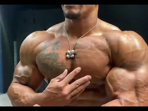 Black muscle god Patrick Moore showing his big muscle pecs