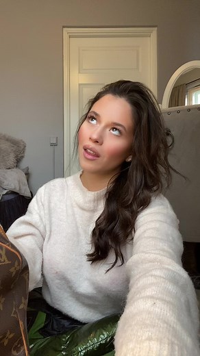 Wavy Hair Fashion in a Cozy Room Setting