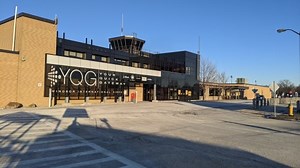 What would it mean if YQG lost its air traffic control tower?