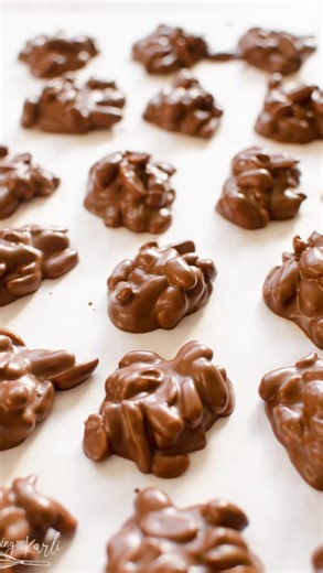 Karli | Family Food Blogger on Instagram: "Introducing the BEST Holiday Peanut Clusters! 🔥 A perfect blend of semi-sweet chocolate, white chocolate, and peanut butter, these are a must-make this Christmas!🎄 Search ‘peanut cluster’ using the link in my bio for the full recipe @cookingwithkarli holiday treat | peanut clusters | chocolate candy | christmas dessert | homemade candy | holiday baking | easy dessert | no bake recipe"