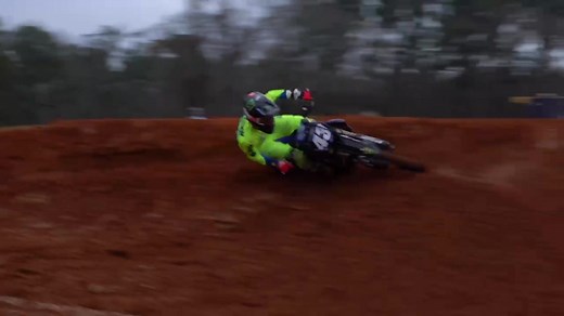 Motocross Riders Showcase Skills on Dirt Track