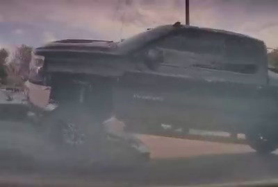 I’m calling shenanigans on this Lamborghini getting run over by the lifted truck.