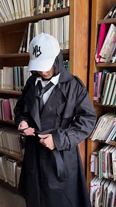 Styling a black trench coat for a quiet day at the library