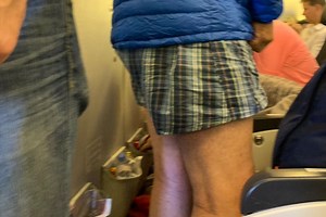 Passenger stunned after male flyer strips to his BOXERS for 12-hour flight