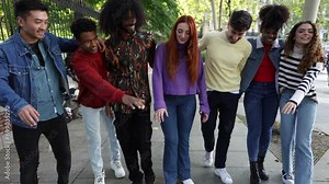 video of a group of multicultural friends joining hands and cheering while laughing - friendship and diversity concept