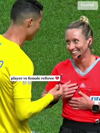 Football Players Interacting with Female Referee