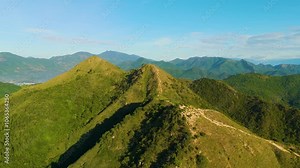 Aerial panoramic around flight view hills slopes of a rocky trail hiking ridge Angel Mountain Peak One Co Tien Hon Kho