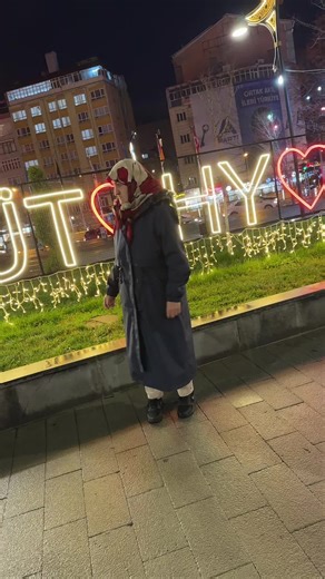 Urban Night Scene with 'KUTUH' Sign