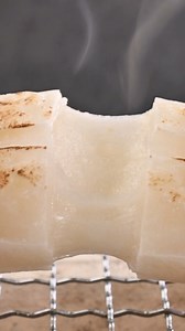 12K views · 533 reactions | Yaki mochi, a grilled or baked snack tailor-made for the winter season, holds a special place in traditional Japanese households. As some families warm their rooms with stoves, they transform a simple mochi block by charring its exterior over the stove until it reaches the perfect balance of crispiness. Slice through the outer layer to reveal a delectably gooey inside!  Have you ever had yaki mochi? | All Nippon Airways | Facebook