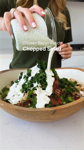 A protein-packed salad I've been having on repeat! 😉 It's layered with juicy grilled chicken, crispy bacon, fresh crunchy vegetables, and the best creamy homemade ranch dressing. | Downshiftology