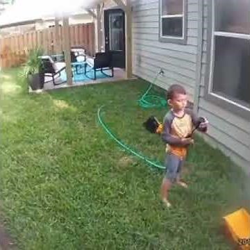 Kid Sprays Security Camera with Hose