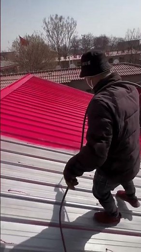 the process of painting asbestos on the roof of a building using a spray is easy and fast #popular