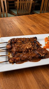Peanut sauce and grilled meat define sate Madura