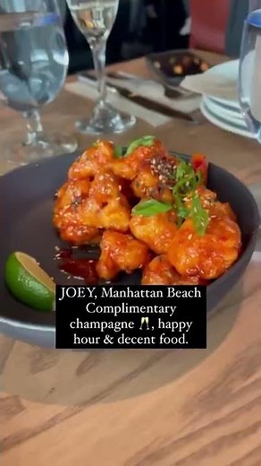 JOEY in Manhattan Beach, CA has complimentary champagne & decent food!