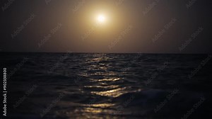 full moon ocean waves create scenic panorama on tranquil beach nighttime view sparkling starlight over the Persian Gulf an enchanting travel destination for adventure and exploration in iran landscape