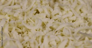grated yellow semi-hard cheese with holes, fresh cheese from milk grated with pieces for cooking