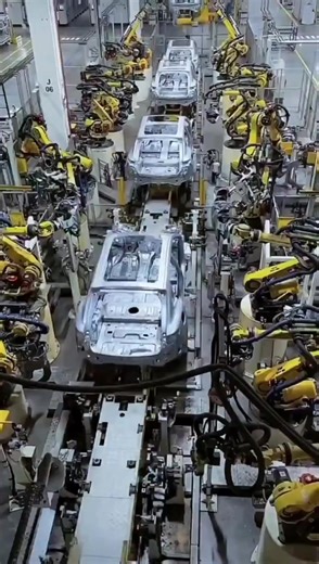 This is an Electric vehicle factory in Chongqing, China, where hundreds of robotic arms move in perfect synchrony and logistics robots shuttle through the factory. The key processes are 100% automated! China is leading the green transformation! cr: ShanghaiPanda #china #robots #hightech #factory #fyp #viral #trend | Go Chengdu