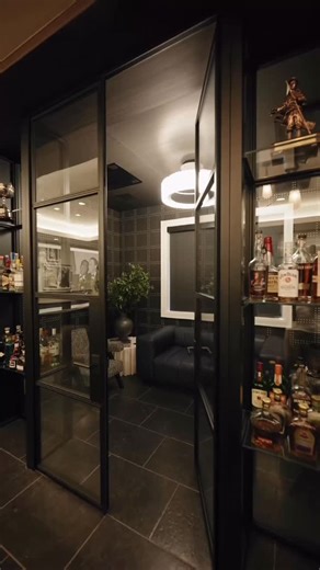 Weldwork | Interior Steel Doors on Instagram: "A beautiful lower level lounge designed for entertaining at the highest level. Complete with a full bar, cigar lounge, and an inviting entertainment space that blends comfort with craftsmanship. An incredible collaboration with Sterling Development and AMW Design Studio—thoughtful design, elevated materials, and attention to every detail. Please enjoy. 🍸✨ #steeldoors #cigar #cigarlifestyle #basement #interiordesign"