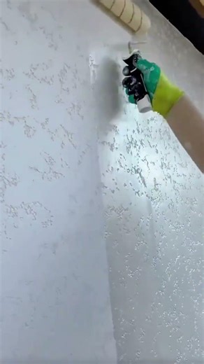 Coating Interior Walls With A Textured Roller To Create A Modern Decorative Wall Finish