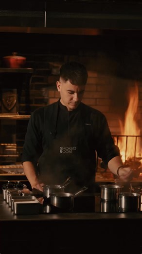 An intimate, chef-led omakase experience centered around fire and smoke, with limited seats and Michelin recognition. | Smoked Room Dubai