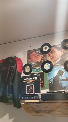johnny cash record display and bandit jacket on the wall beautiful