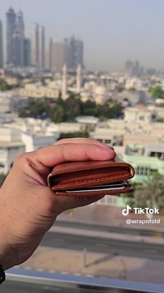 VB1.A Vertical bifold wallet made with pull-up leather two-tone shade. #foryoupage #trendingtiktok #viral #dubai #burjkhalifa