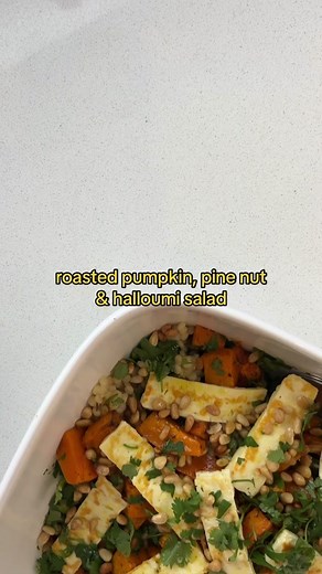 You need to try this roasted pumpkin, pine nut and halloumi salad!! INGREDIENTS: 1 large handful of rocket coriander, finely chopped 1/3 cup pine nuts, toasted 180g halloumi, sliced ROASTED PUMPKIN 600G pumpkin, diced 1 tbsp olive oil 1 tbsp dried mixed herbs or seasonings of choice salt/pepper COUSCOUS 1 cup pearl couscous 2 cups vegetable stock LEMON & HONEY DRESSING 1/2 cup olive oil 3 tbsp lemon juice 1 tbsp honey 2 tsp minced garlic salt/pepper Method: 1. Preheat oven to 200°c and line a ba