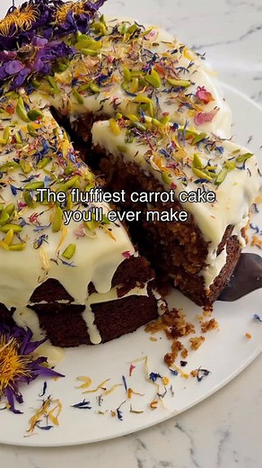 The fluffiest, most moist carrot cake… thanks to one simple thing: pineapple. It keeps the cake unbelievably soft, and the pour-over cream cheese icing makes it even better. Two layers, simple ingredients, and that pretty drip on top. Full method below — save this one for your next gathering. Find the full recipe on my website. Ingredients Main Ingredients 2 cups plain flour (310 grams) 2 teaspoons baking soda 2 teaspoons baking powder 1 teaspoon salt 2 teaspoons ground cinnamon 1⁄2 teaspoon gro