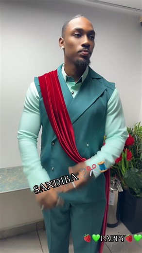 Papito🍓💚 @PAPPYPMXTRA💪🏾🔥 in @SANDIBA✂️DESIGNER🪡STYLIST🧵👗 wearing “THE SOVEREIGN SLAYER” This ensemble is a bold exercise in structural tailoring and color blocking, blending traditional formalwear with avant-garde draping. THE OUTFIT DESCRIPTION: • The Base Layer: A mint-green, long-sleeved dress shirt serves as a bright foundation, providing a sharp contrast to the deeper tones of the outerwear. • The Outerwear: A sleeveless, double-breasted teal vest suit features wide notched lapels a