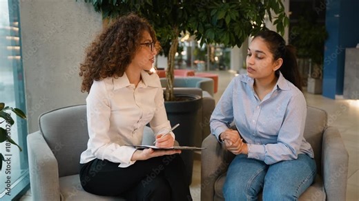 Human resources manager interviewing a female job candidate
