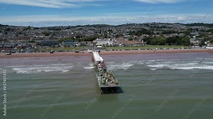 Paignton, Torbay, South Devon, England: DRONE VIEWS: Paignton Pier viewed on a sunny day. Paignton is a popular English holiday destination especially with sailing and water sports enthusiasts (2).