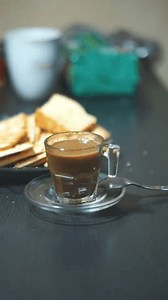 clip-3479375809-man-enjoying-cup-milk-coffee-bread-night