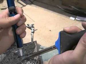 How to desolder solder from an electronic component on a printed circuit board?