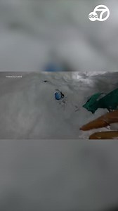 Dramatic video shows a snowboarder who was buried alive upside down in the snow being saved by a skier who happened to see the snowboard sticking out of the snow. https://abc7.la/3M4Nb68 | ABC7