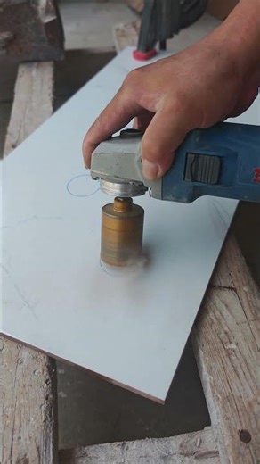 Tiling skills: accurately positioning and opening holes with a laser tube level