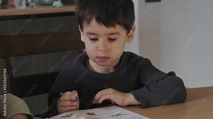 Mother's hand showing the boy how to solve the exercise correctly. Studying, doing homework.